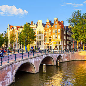 Photo of a bridge crossing Amsterdam canal