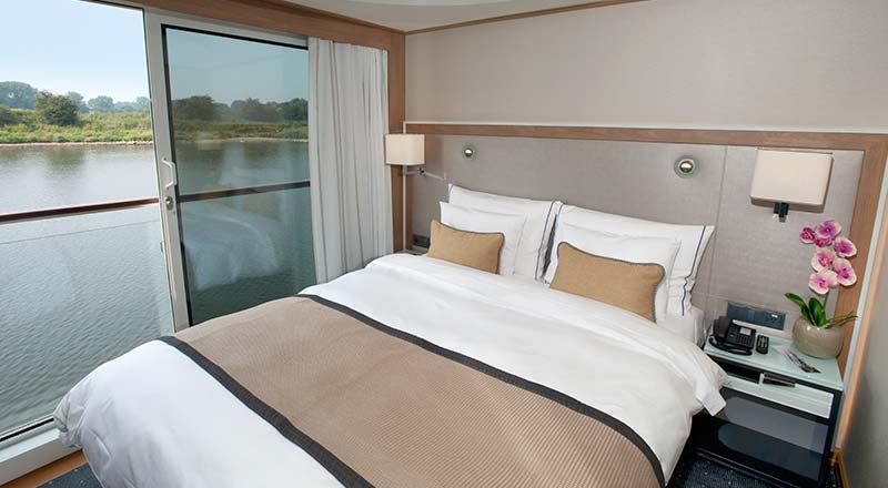 Bed of a Veranda stateroom on board a Viking river ship
